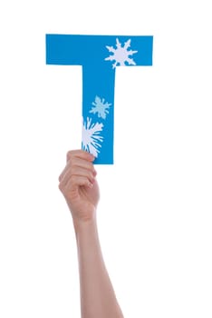 A Hand Holding the Blue and Snowy Letter T, Isolated