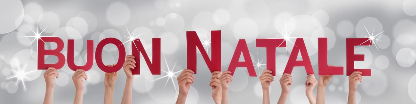 The Italian Words Buon Natale Which Means Merry Christmas on a Festive Silver Background