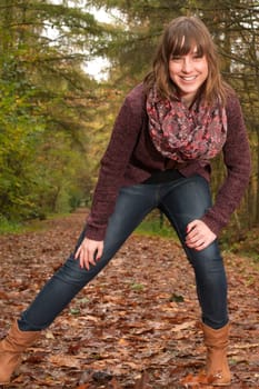 Young woman in the autumn at a cold november day
