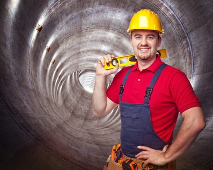 portrait of manual worker in concrete tunnel