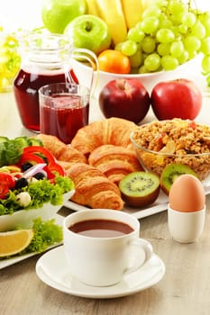 Breakfast with coffee, juice, croissant, salad, muesli and egg. Swedish buffet
