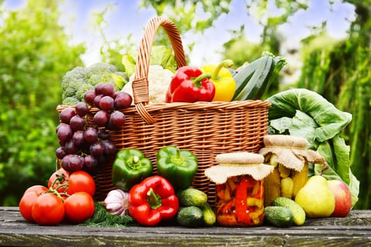 Fresh organic vegetables in wicker basket in the garden
