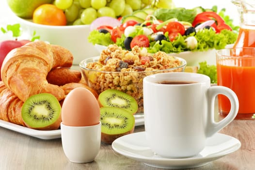 Breakfast with coffee, juice, croissant, salad, muesli and egg. Swedish buffet