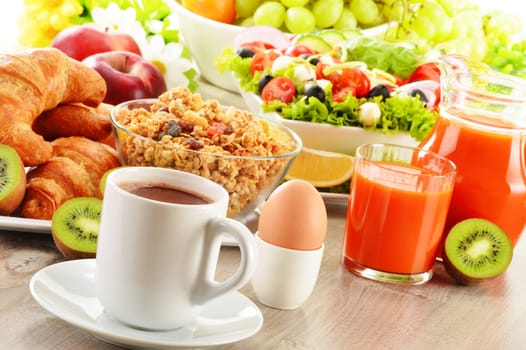 Breakfast with coffee, juice, croissant, salad, muesli and egg. Swedish buffet