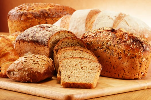 Wicker basket with bread and rolls Composition with bread and rolls. Baking products.