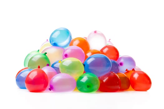 A pile of colorful water balloons isolated on white background