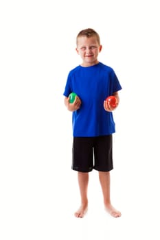 Boy holding water balloons isolated on white background