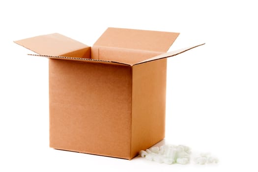 Shipping box with packaging material isolated on white background