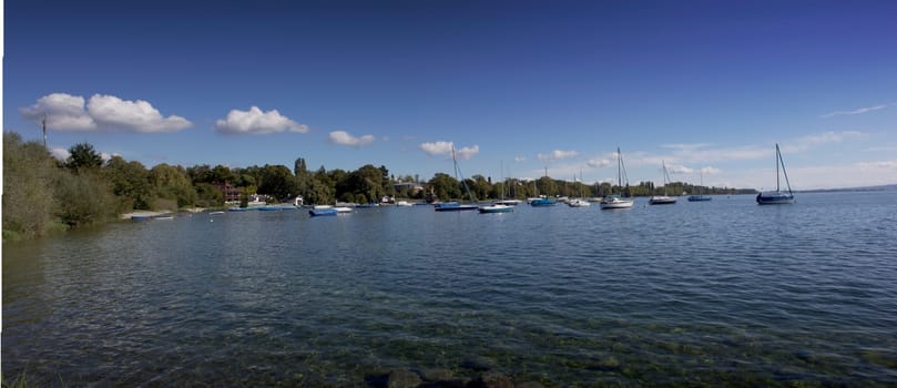 lake of constance with view to the landscape and sailing boats