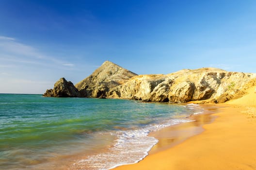 Clear blue water on a desert beach near Cabo de la Vela in La Guajira, Colombia