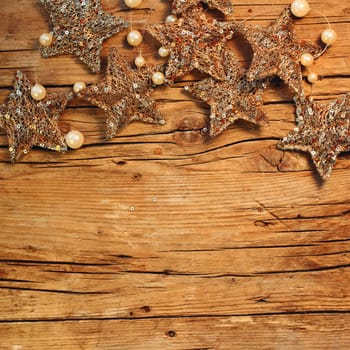 Golden stars,perls and wood background