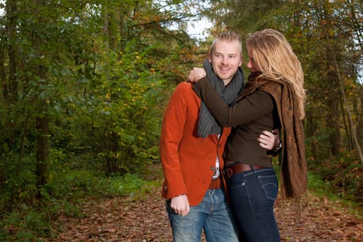 Happy young couple is having a nice time in october