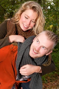 Happy young couple is having a nice time in october
