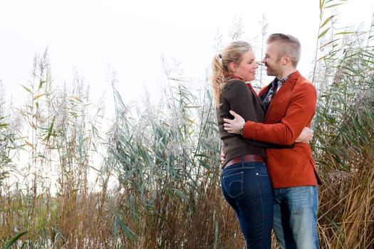 Happy young couple is having a nice time in october