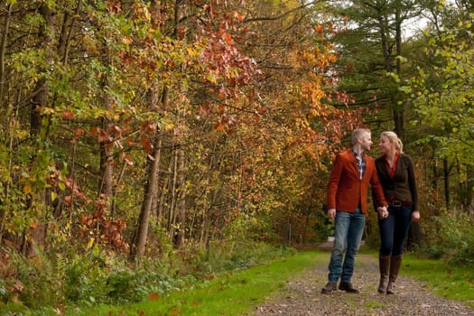 Happy young couple is having a nice time in october