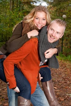 Happy young couple is having a nice time in october