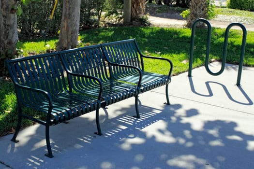 Some shade on a sunny day in a park where you can secure your bike in a rack and just relax on the bench on this beautiful afternoon in southeast Florida..
