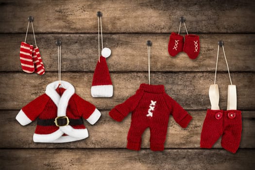 Santa Claus clothes hung on wooden wall