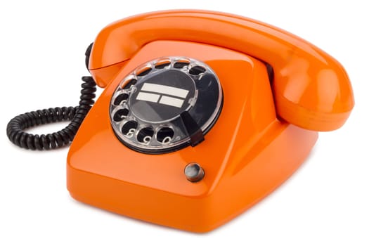Old retro phone with dial in orange