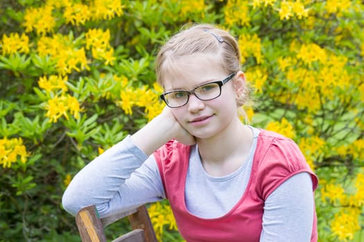 Young girl in park in spring day - portrait