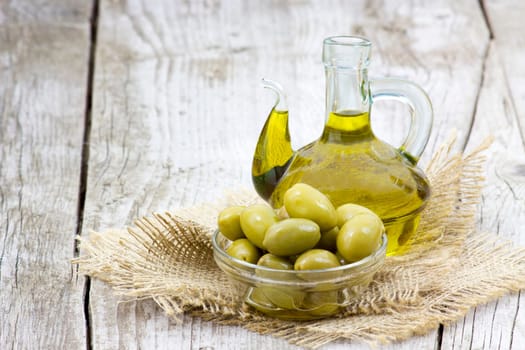 Olive oil and green olives