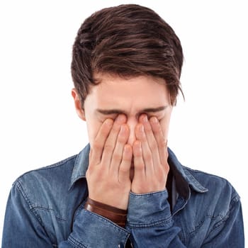 Young man hiding his face with his hands