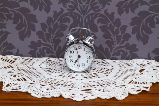 Nostalgic alarm clock on crochet blanket