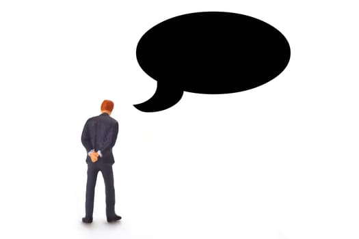 Figure of a manager from behind with a speech bubble