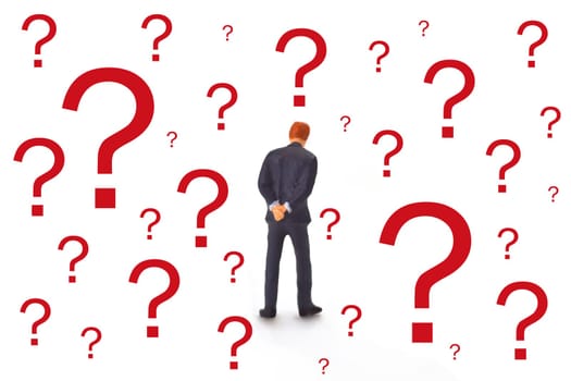 Figure of a manager from behind with red question marks