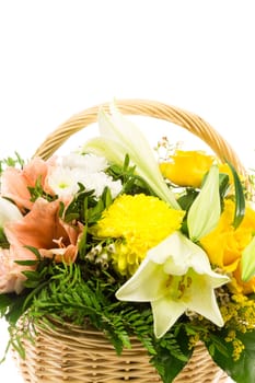 A wicker basket filled with a bouquet of flowers