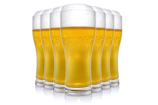 Seven beer glasses arranged over a white background