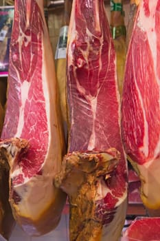 Three pieces of Spanish ham ready to be sold on the market.