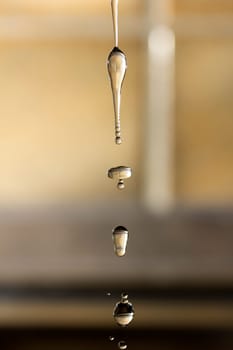 The fluid motion of water splashing as it is poured.