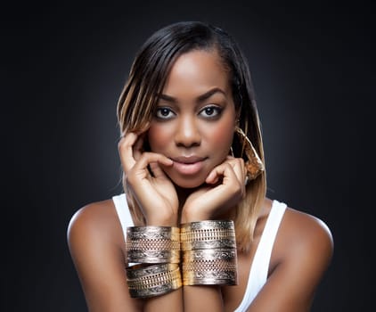 Black beauty wearing golden accessories