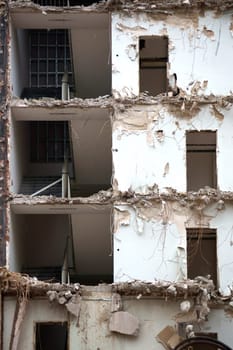The photograph of a demolished,badly damaged house.