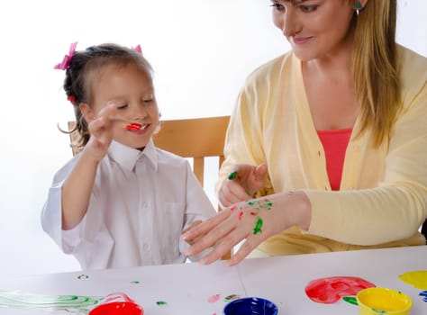 mother and daughter paint with finger