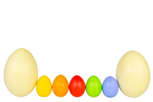 Colorful Easter eggs and two Nandu eggs in a row at the bottom of the picture