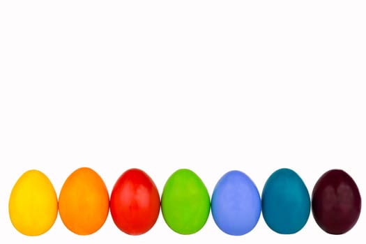 Colorful Easter eggs in a row at the bottom of the picture
