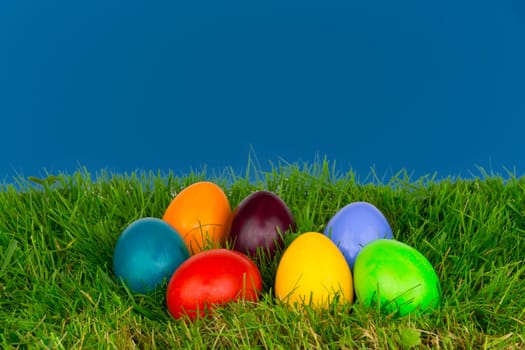 Colourful Easter eggs in a meadow
