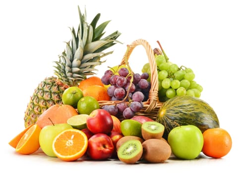 Variety of fruits in wicker basket isolated on white background