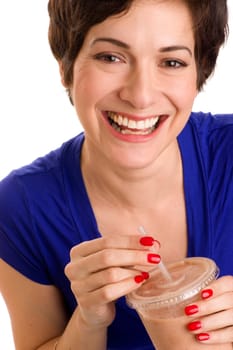 Beautiful woman with manicured nails sips a neutral colored food fruit smoothie