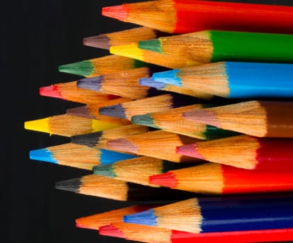 a set of color pencils sharpened and ready for use art supplies artist tools white background