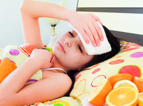 Sick young girl in bed