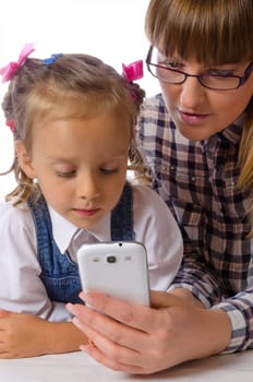 mother and daughter with mobile phone