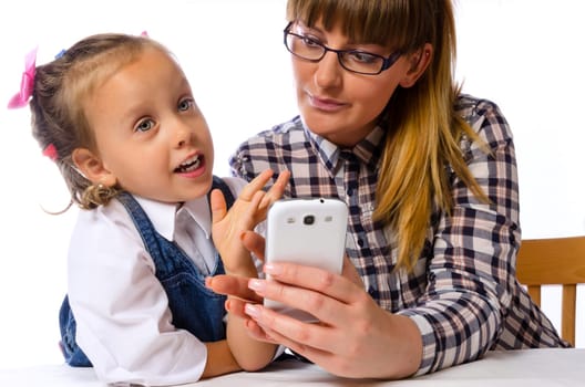 mother and daughter with mobile phone
