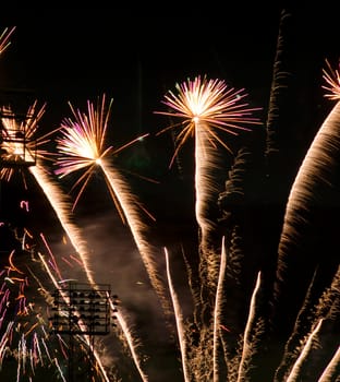 A simple display of fireworks over a baseball stadium