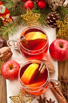 Hot drink for Christmas with cinnamon and oranges