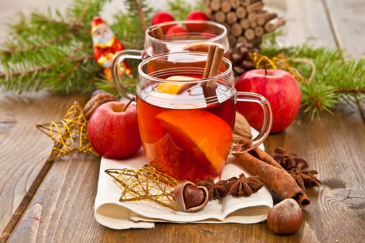 Hot drink for Christmas with cinnamon and oranges