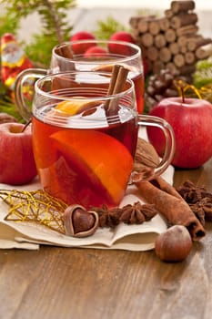 Hot drink for Christmas with cinnamon and oranges