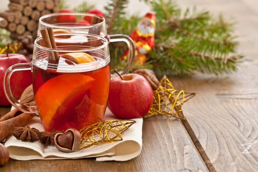 Hot drink for Christmas with cinnamon and oranges